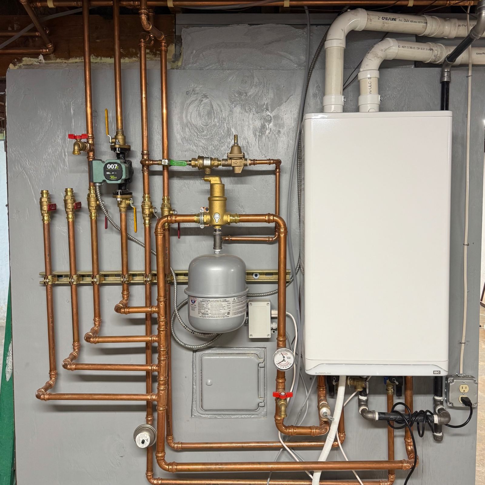 Residential boiler installation with clean copper near-boiler piping
